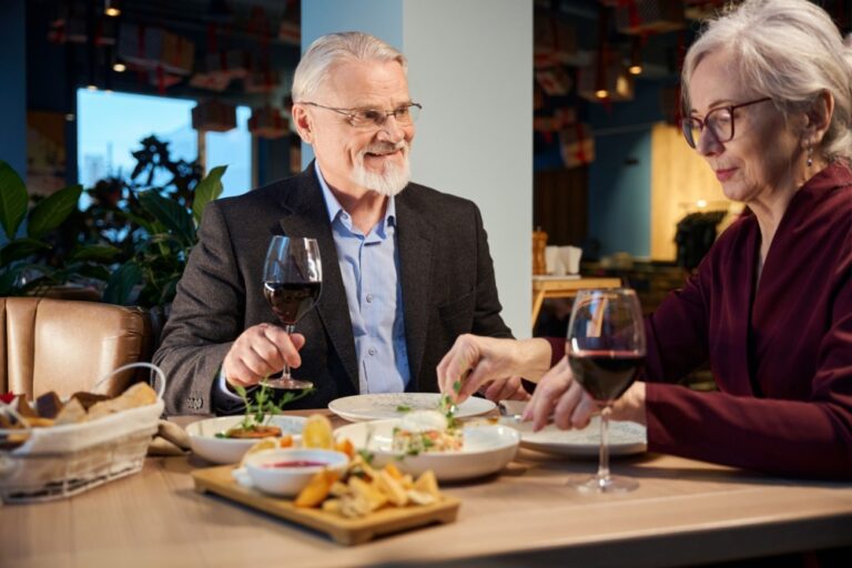 A couple enjoying a meal in a restaurant together.