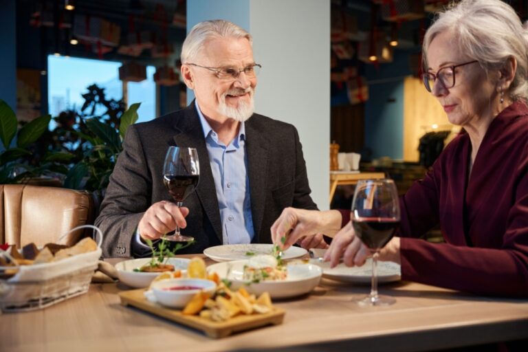 A couple enjoying a meal in a restaurant together.