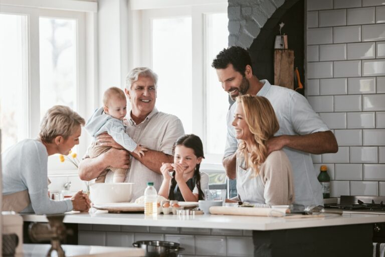 Three generations of family cooking in the kitchen