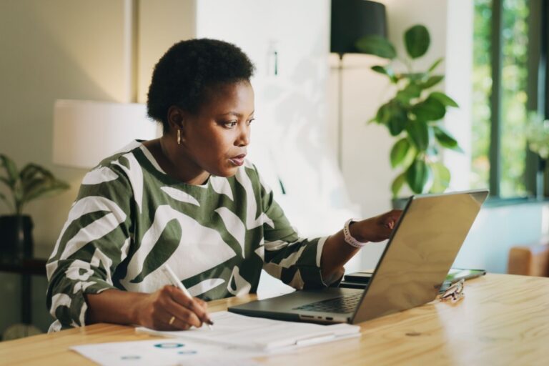 A woman on her computer.