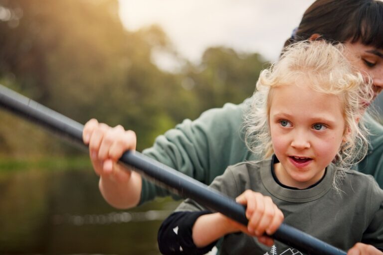 A mum and child kayaking.