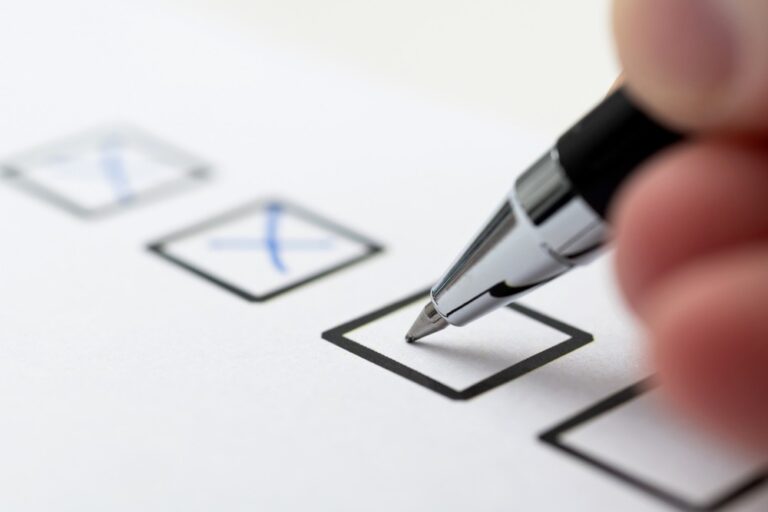 A person checking tick boxes.